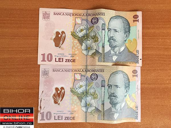 Aveţi grijă, la Cluj circulă bancnote false! Cum să le deosebiţi