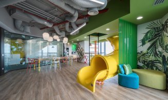 Angajații de la NTT DATA intră în bucătărie de pe tobogan. Cum arată noul sediu