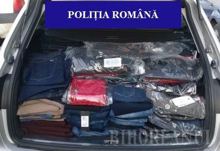 Clujeni, prinși la vândut de haine fake de mii de euro în Oradea