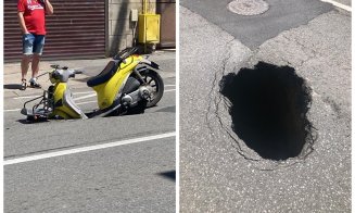 O gaură uriașă s-a căscat în asfalt și aproape a "înghițit" un scuter, pe o stradă din Cluj-Napoca