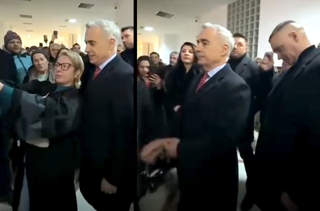 ”Fanii” lui Georgescu i-au spus un Tatăl Nostru pe holurile Tribunalului. Cum le-a ignorat fostul candidat la prezidențiale momentul de evlavie