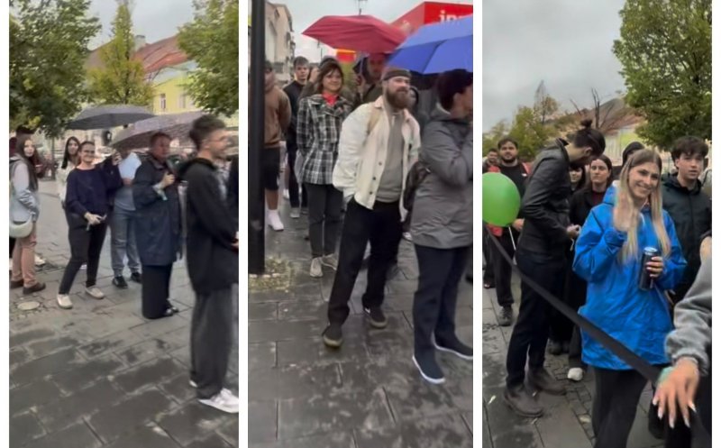 Coadă mare pe Eroilor în Cluj-Napoca pentru burgeri gratis. Clujenii așteaptă și pe ploaie